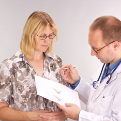 Doctor and patient discussing breast implant procedure