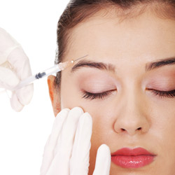 Model's face receiving injection above right eye